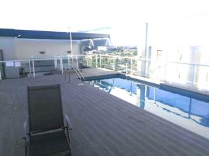 a swimming pool on top of a building at Excelente departamento en Las Condes in Santiago