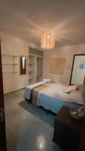 Ένα ή περισσότερα κρεβάτια σε δωμάτιο στο Casa do Kite