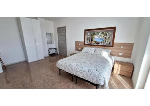 Ένα ή περισσότερα κρεβάτια σε δωμάτιο στο B&B La Promessa