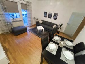 an overhead view of a living room with a couch and a table at Düsseldorf Apartment in Düsseldorf +4 photos