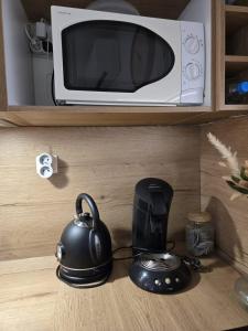 Kuchyň nebo kuchyňský kout v ubytování Mini villa vue jardin dans résidence calme wifi piscine mer à pied + 20 fotografií