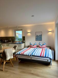 Ένα ή περισσότερα κρεβάτια σε δωμάτιο στο H24ZINGST - Das Ferienhaus