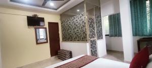 Postel nebo postele na pokoji v ubytování JS Holidayss Inn + 4 fotografie