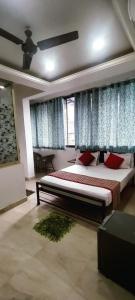 Postel nebo postele na pokoji v ubytování JS Holidayss Inn