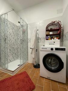 a washing machine in a bathroom with a shower at B&B Souvenirs d'Antan in Orvinio +61 photos