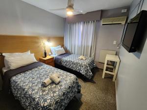 Postel nebo postele na pokoji v ubytování HOTEL JUAN B JUSTO GARDEN Pet friendly