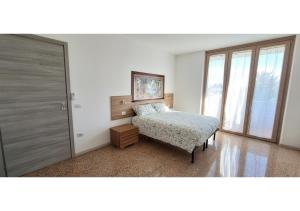 Ένα ή περισσότερα κρεβάτια σε δωμάτιο στο B&B La Promessa