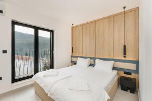 Postel nebo postele na pokoji v ubytování Apartments Villa Swissmonte 2