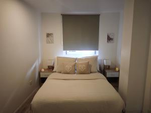 Кровать или кровати в номере Sweet Home