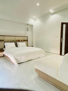 Postel nebo postele na pokoji v ubytování Villa adventureskribi