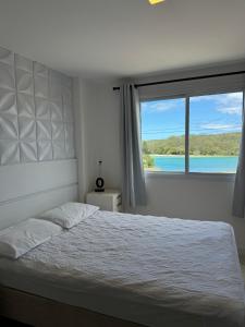 Ένα ή περισσότερα κρεβάτια σε δωμάτιο στο PACIFIC - PRAIA DO FORTE