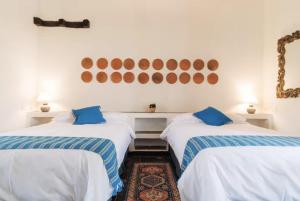 Ένα ή περισσότερα κρεβάτια σε δωμάτιο στο Casa Natania