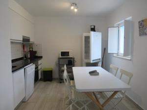 Kuchyň nebo kuchyňský kout v ubytování Maria's Village