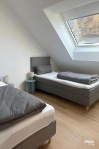 Postel nebo postele na pokoji v ubytování AIL Kün Living