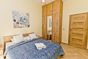 Postel nebo postele na pokoji v ubytování Hevenia Mrzeżyno 8