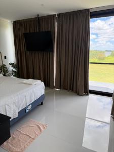 Postel nebo postele na pokoji v ubytování Casa con Piscina sobre Laguna Brava - Tranquilidad y Naturaleza en Barrio Privado