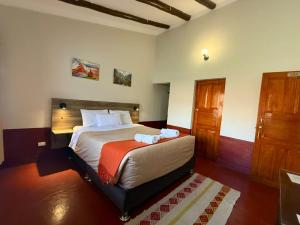 Una cama o camas en una habitación de Chaska Valle Green