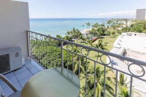 a balcony with a view of the ocean at Waikiki Shore 1014 in Honolulu