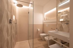 a bathroom with a shower and a toilet and a sink at Residenza Galileo -affittacamere Padova sud in Albignasego +50 photos
