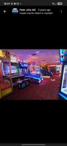 a video game room with arcade games and a video game console at Marton Mere 8 Berth Caravan in Blackpool