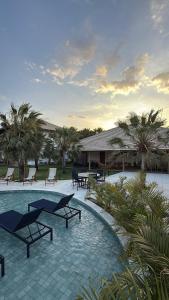 Πισίνα στο ή κοντά στο Casa a 2 minutos a pé da praia