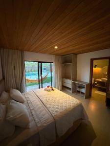 Ένα ή περισσότερα κρεβάτια σε δωμάτιο στο Casa a 2 minutos a pé da praia