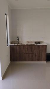 a bathroom with a sink and a counter in a room at La Casita de Condoray - Lunahuana in Lunahuaná