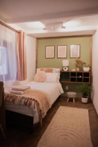 Postel nebo postele na pokoji v ubytování Árnyaskert Vendégház