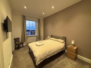 Ένα ή περισσότερα κρεβάτια σε δωμάτιο στο Brandon House