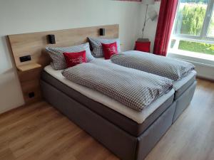 Ένα ή περισσότερα κρεβάτια σε δωμάτιο στο Ferienwohnung Fraenkisches Paradies