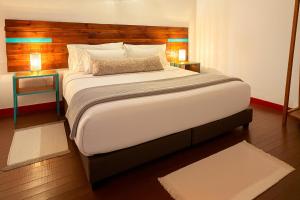 Postel nebo postele na pokoji v ubytování Dreamer Cocora