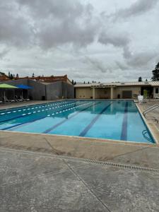 a large swimming pool on top of a building at Spacious Studio Near Beaches & Dining in Waikoloa Village