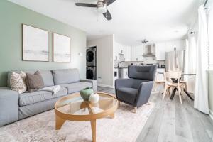 a living room with a couch and a table at The Vibe on Durham XI 8788 in Durham