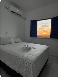 Ένα ή περισσότερα κρεβάτια σε δωμάτιο στο Apartamento da Kenia