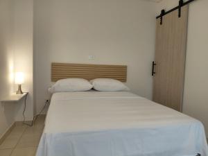 Voodi või voodid majutusasutuse Hotel Stadio Cali toas +7 fotot