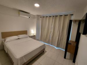 Voodi või voodid majutusasutuse Hotel Stadio Cali toas