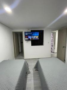 Μια τηλεόραση ή/και κέντρο ψυχαγωγίας στο Hotel boutique Olaya 54 +42 φωτογραφίες