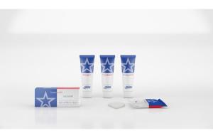 a group of four milk bottles and a box at Americas Best Value Inn Seward in Seward