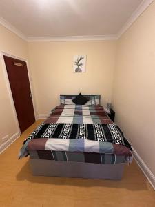 a bedroom with a bed in a room at Double & Single rooms in Southall in Southall
