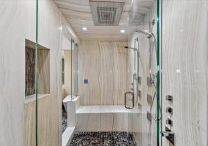 a bathroom with a shower and a sink at High-end Coastal Escape in Sunny Isles Beach +17 photos