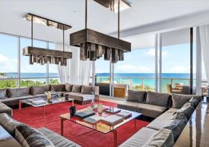 a living room with a couch and a table at High-end Coastal Escape in Sunny Isles Beach