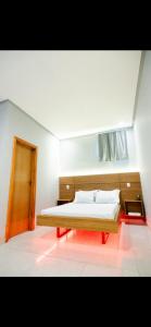 En eller flere senge i et værelse på Pousada Malibu 116