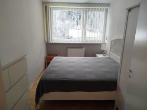 Ένα ή περισσότερα κρεβάτια σε δωμάτιο στο Harmónia 2