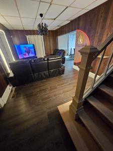 Una televisión o centro de entretenimiento en Villa Del Sol 3 Dormitorios