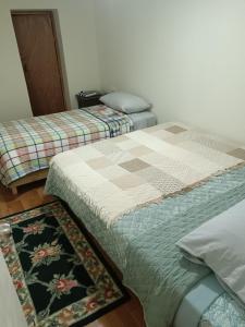 En eller flere senge i et værelse på Hostal poetas de Cartagena