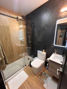 a bathroom with a toilet and a shower and a sink at Cozy Home away from home! in Miami +27 photos