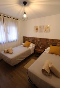 En eller flere senge i et værelse på Villa Rural Puerta del Gallo + 12 billeder