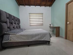 Ένα ή περισσότερα κρεβάτια σε δωμάτιο στο Finca La Rosa