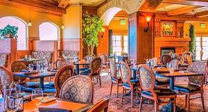 a restaurant with tables and chairs in a room at Zermatt Double Queen Suite Near Park City - 3074 in Mound City