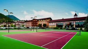 a tennis court in front of a building at Zermatt Double Queen Suite Near Park City - 3074 in Mound City